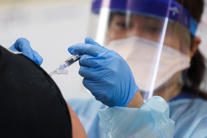 Southern California Residents Line Up For Flu Shots At Local Library
